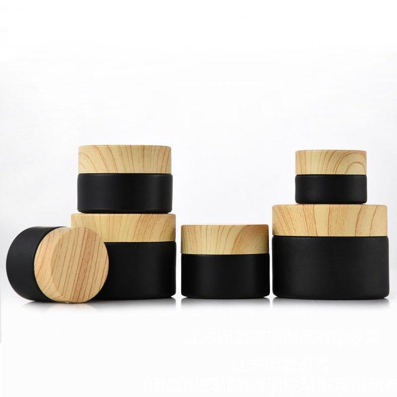 

Black frosted glass Packing Bottles jars cosmetic with woodgrain plastic lids PP liner 5g 10g 15g 20g 30 50g lip balm cream containers