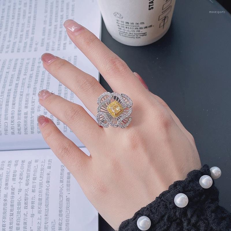 

Wedding Rings Europe America Luxury Flower Inlay Yellow Crystal Zircon Hollow Petals Geometry Jewelry For Women Cocktail Party1
