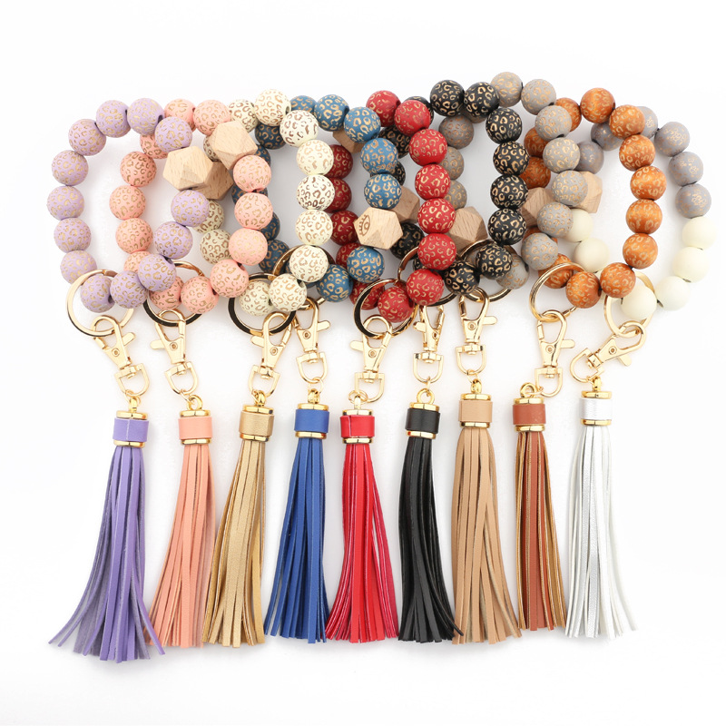 

Wholesale leopard spotted wood bead bracelet keychain PU leather tassel pendant chain multicolor optional cross-border, Blue