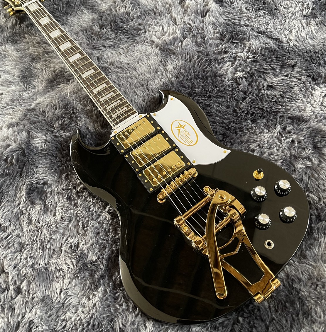 

Rare Double Cutaway Gloss Black SG Electric Guitar 3 Humbuckers Pickups, Bigs Tremolo Bridge, Gold Hardware, Star Logo White Pickguard, Grover Tuners