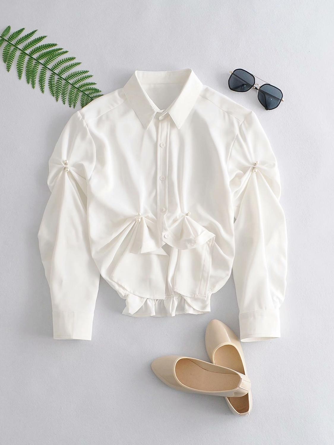 

2021 French Lapel Pleated Ruched Button Pearl White Shirt Short Women Blouse Hem Irregular Blouse Long Puff Sleeve Tops