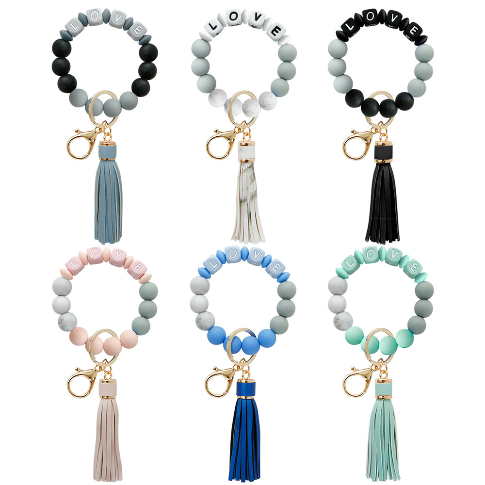 

Silicone Love Beads Tassel charm bracelet key rings Wrap Wristband Keychain Hangs Fashion jewelry will and sandy, Slivery;golden