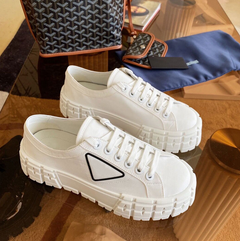 

New Women triangle decorate casual shoes rubber platform inspired by motocross tires defines the unusual design of nylon gabardine sneakers, Black