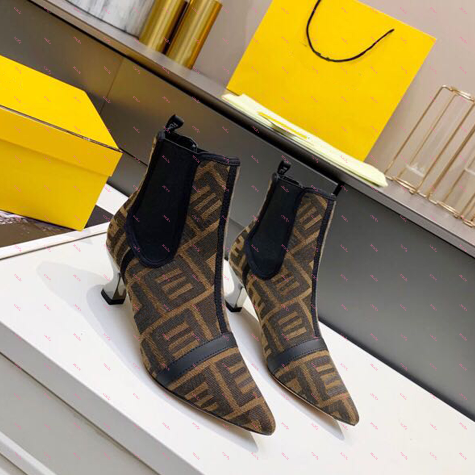 

Women's fall/winter designer high-heeled boots with an F attached to the upper A90