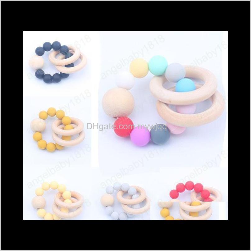 

Natural Wooden Teethers Toys Sile Teether Rattle Heath Accessories Infant Fingers Exercise Colorful Teething Ring Play Lhl10 Pacifier Nqkf5