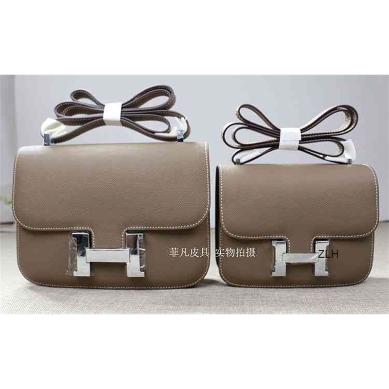 

Women fashion button Box leather cowhide bean curd bag one shoulder slant span 18 24cm women's bag