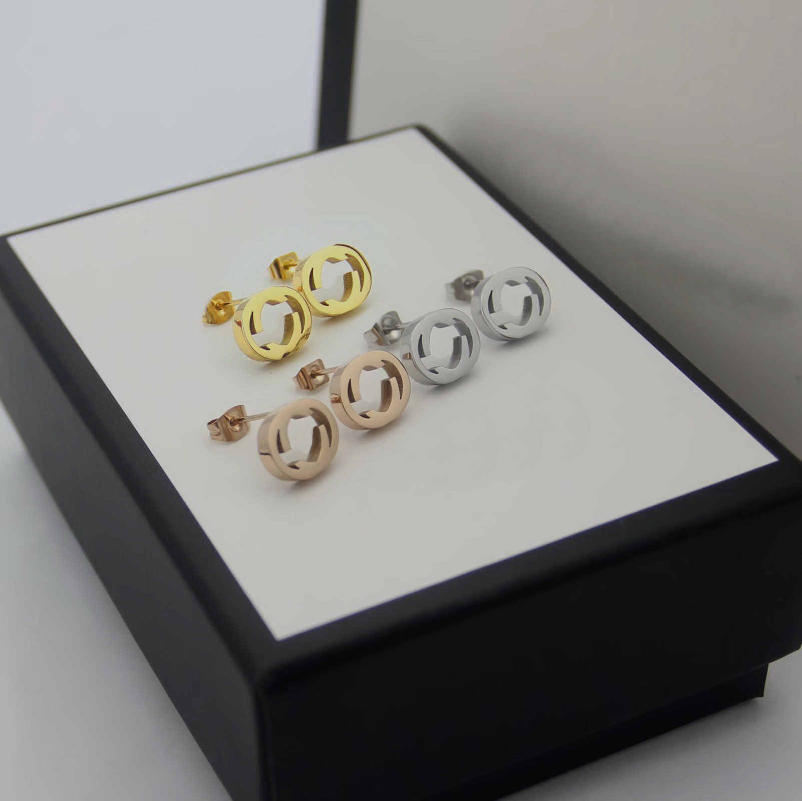 

Europe America Fashion Style Lady Women Titanium Steel Hollow Out Initials Stud Earrings 3 Color