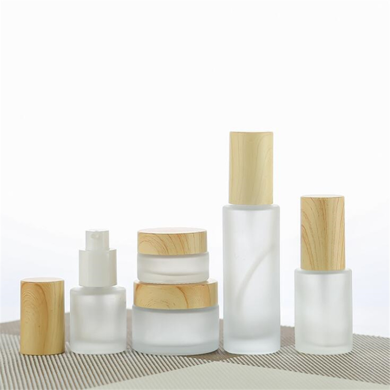 

Frosted Glass Cream Jar Cosmetic Lotion Spray Bottle with Imitated Wooden Lids Refillable Container 20ml 30ml 40ml 60ml 80ml 100ml Packing Bottles