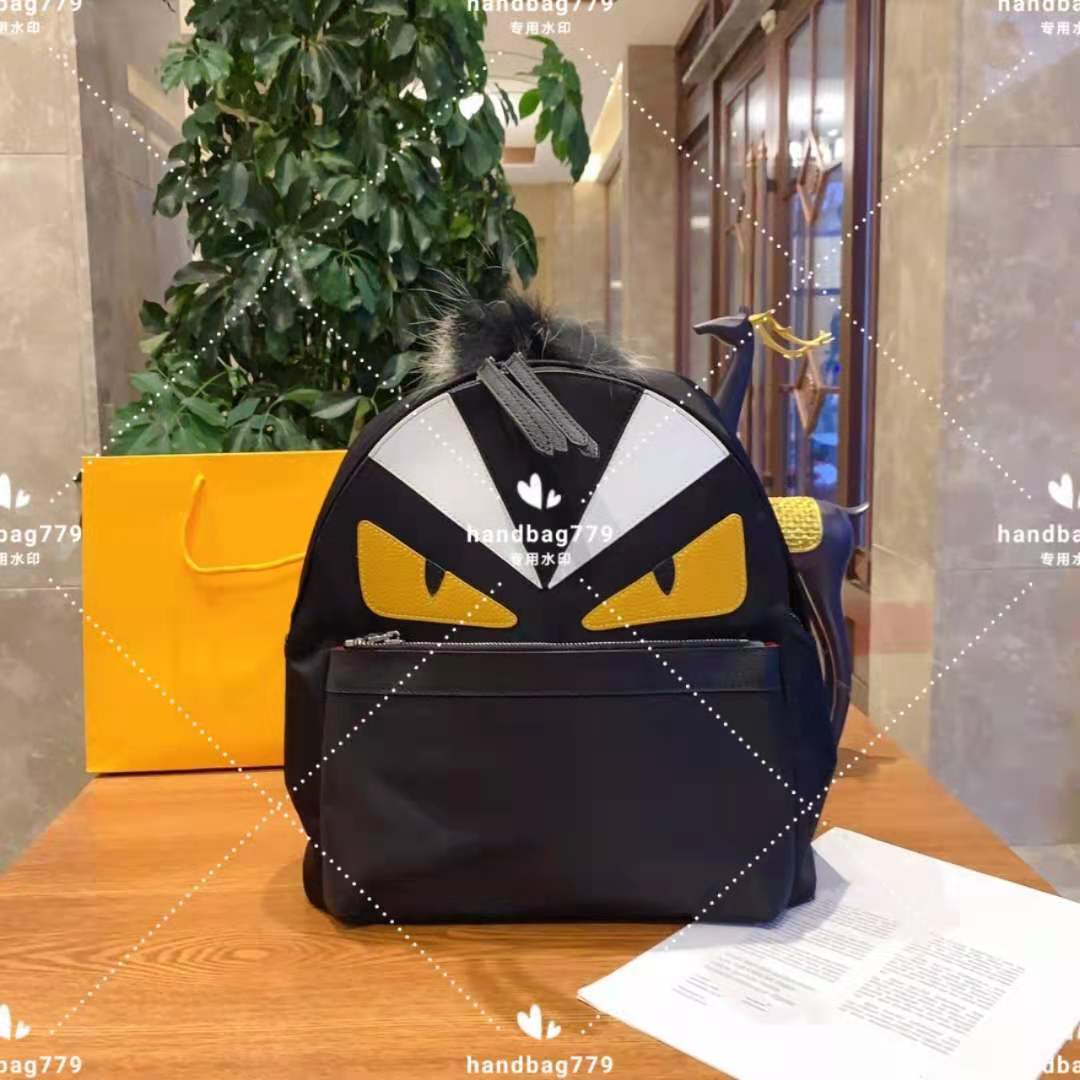 

Couples with Backpack Unisex waterproof nylon cloth little monster cartoon pattern top fur ball design high quality comfortable wide shoulder strap