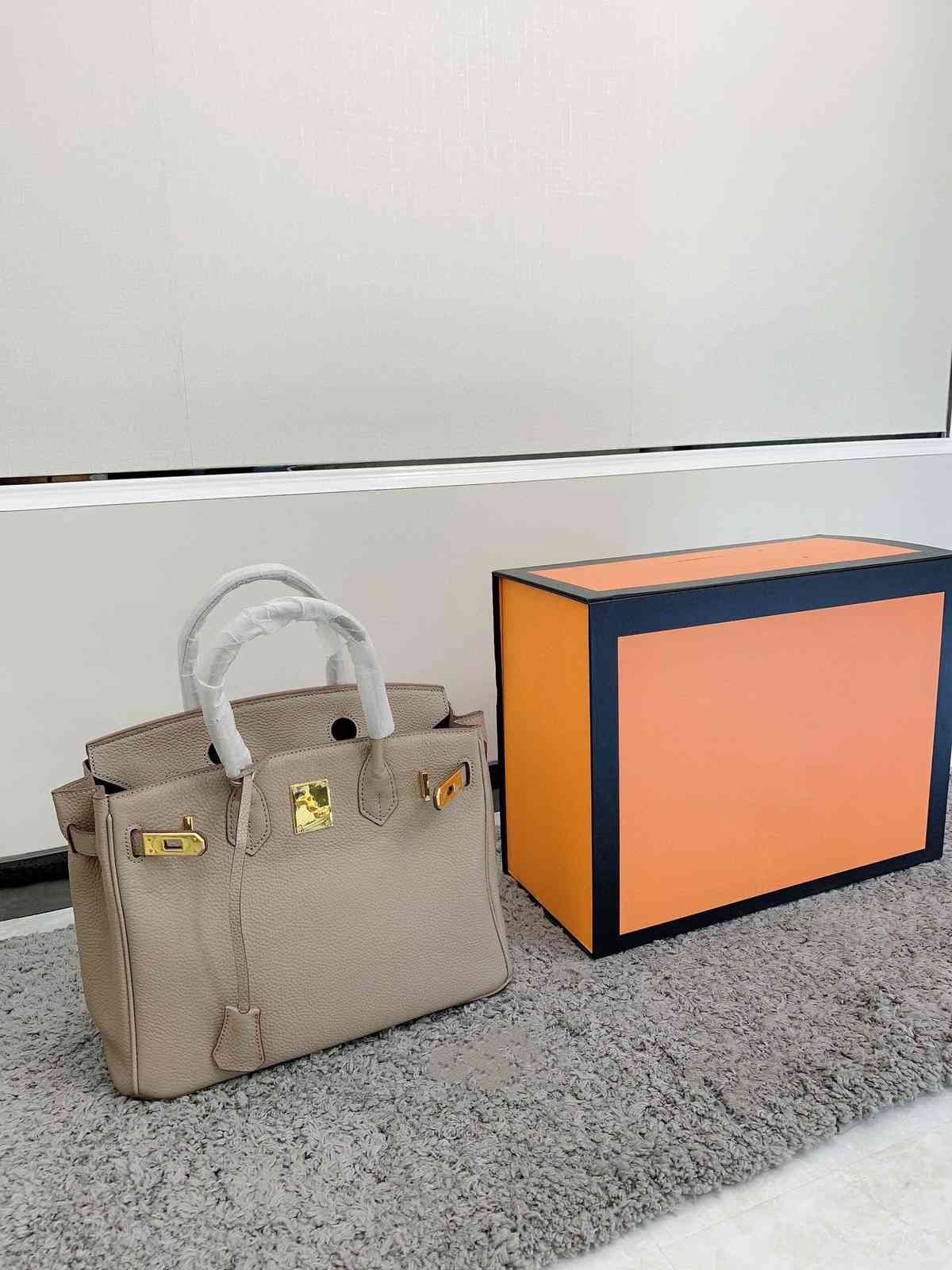 

Designer's top Birkin layer cowhide tote bag with high quality Perkin latch lychee pattern classic fashion and large volume women's bagsST8C, Black