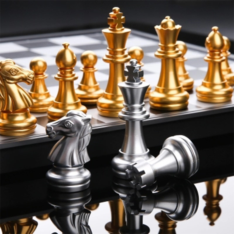 Magnetic chess set folding board elementary school black and white chess pieces gold and silver chess pieces-image-670583163