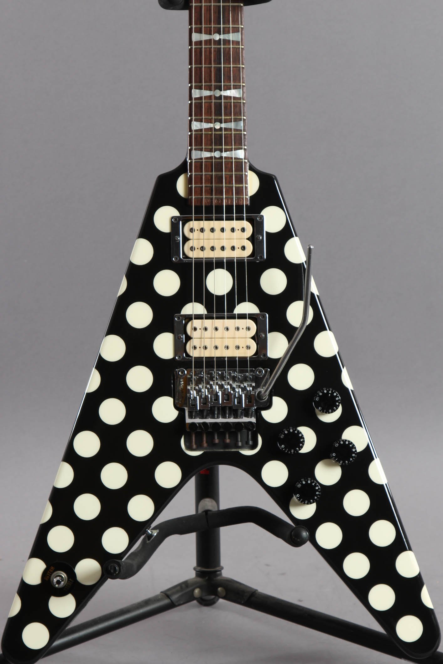 

Jack Son Randy Rhoads Polka Dot Black Flying V Electric Guitar MOP Bowtie Inlays, Floyd Rose Tremolo Bridge & Locking Nut, Whammy Bar, Signature Back Cover, Grover Tuners