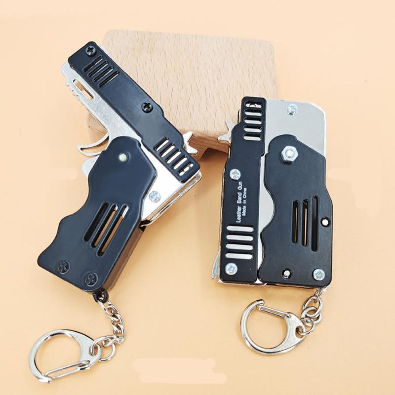 

Keychains Collapsible Rubber Band Pistol 6 Ss CS CF Imitation Guns Keychain Key Ring Gift For Women Men