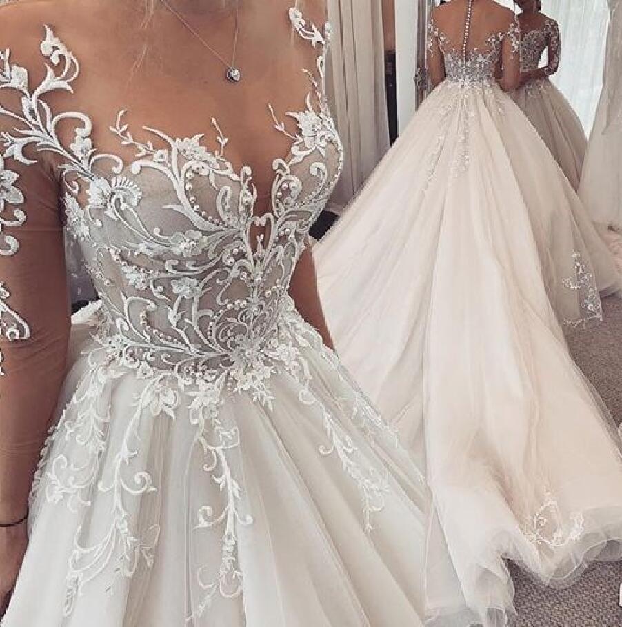 

2021 Simple Illusion Long Sleeves A Line Wedding Dresses Bridal Gowns Jewel Neck Button Back Lace Appliques Pearls Ball Gown Vestido De Novia Custom Plus Size, White