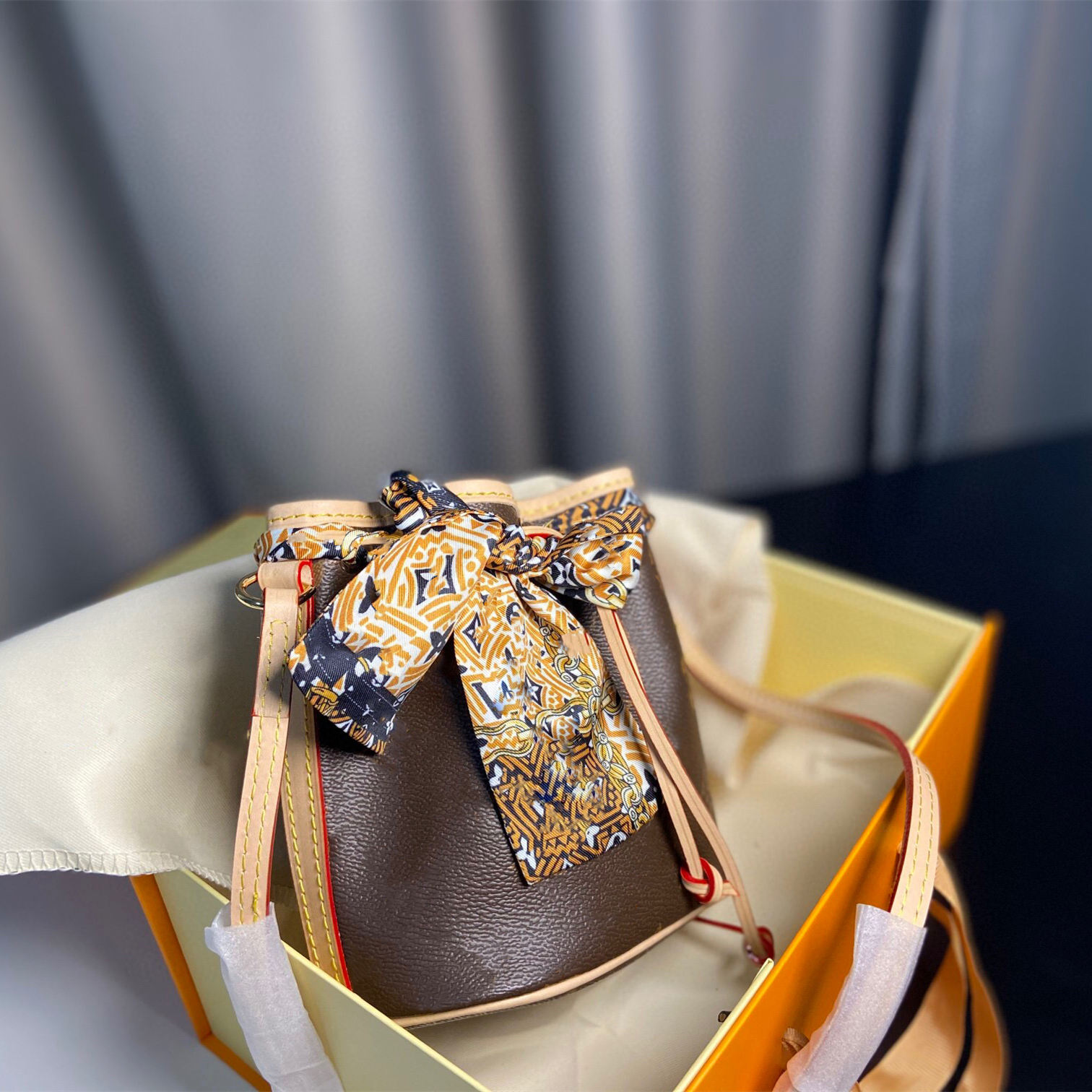 

luxury handbags Mini Shoulder Bags Classic Sturdy Stylish Bucket Bag Coated Canvas Iconic Shape Drawstring Closure Women Adjustable Leather
