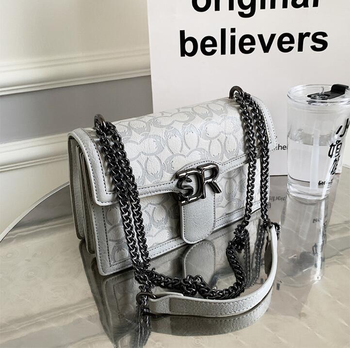 

Wholesale factory ladies leathers shoulder bags Hong Kong style elegant embossed chain bag sweet ladies fashion backpack clamshell shaped leather handbag, White3-342