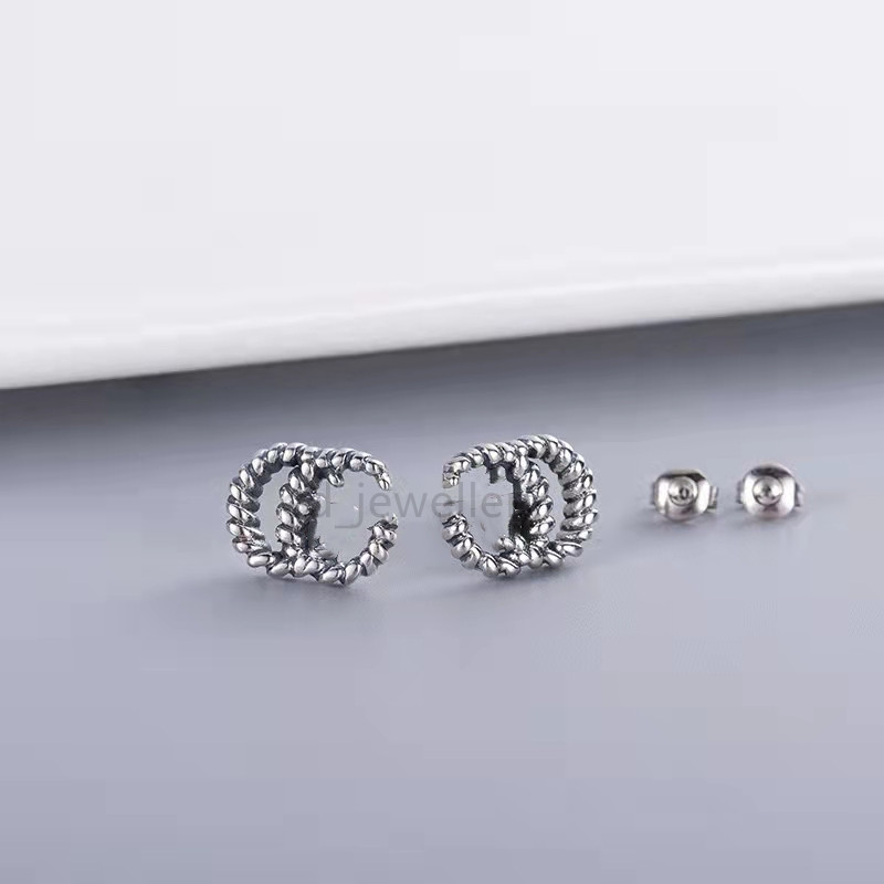 

2022 new brand designer fashion women's simple silver double letter G Earrings high quality titanium alloy earrings couple wedding gift Alex ani