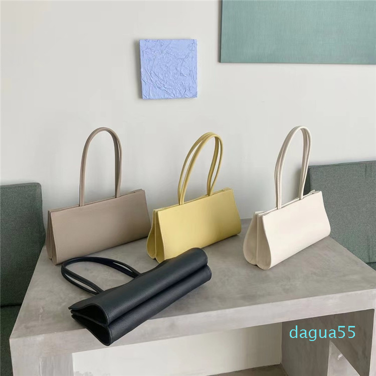 

2021 new solid color first layer cowhide litchi pattern single shoulder bag, small and simple temperament organ armpit stick bag, Black