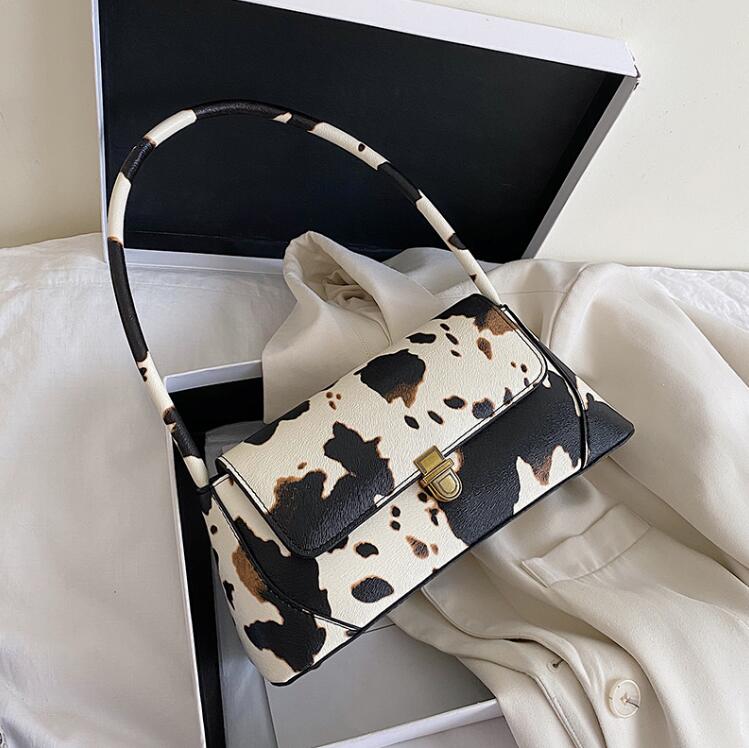 

Cow pattern ladies shoulder bag PU soft leather fashionable and cute underarm bag ladder shape handbag Dot printed Purse, Black
