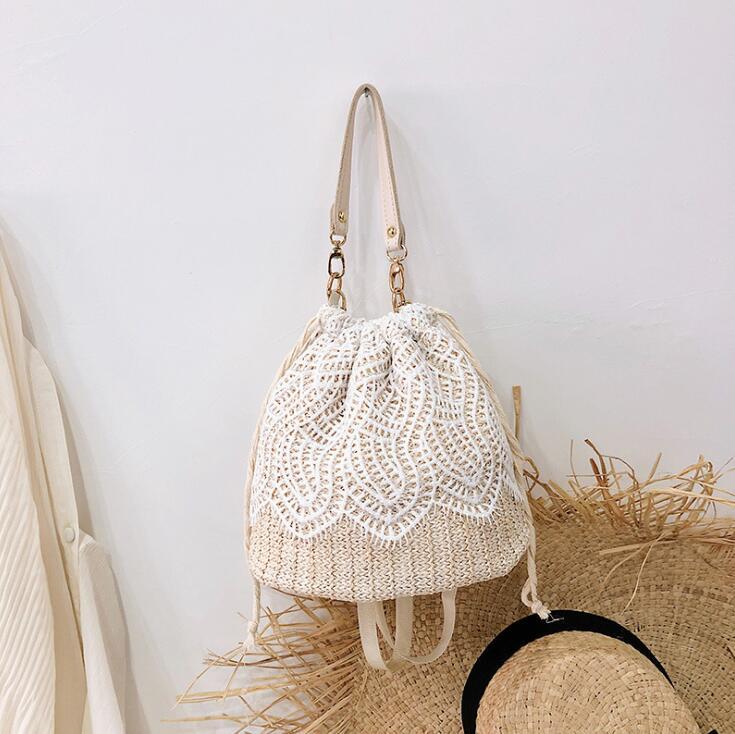 

Factory direct sales of women handbag lace fashion bucket bag high quality woven summer sweet lovely Pearl decoration straw beach handbags