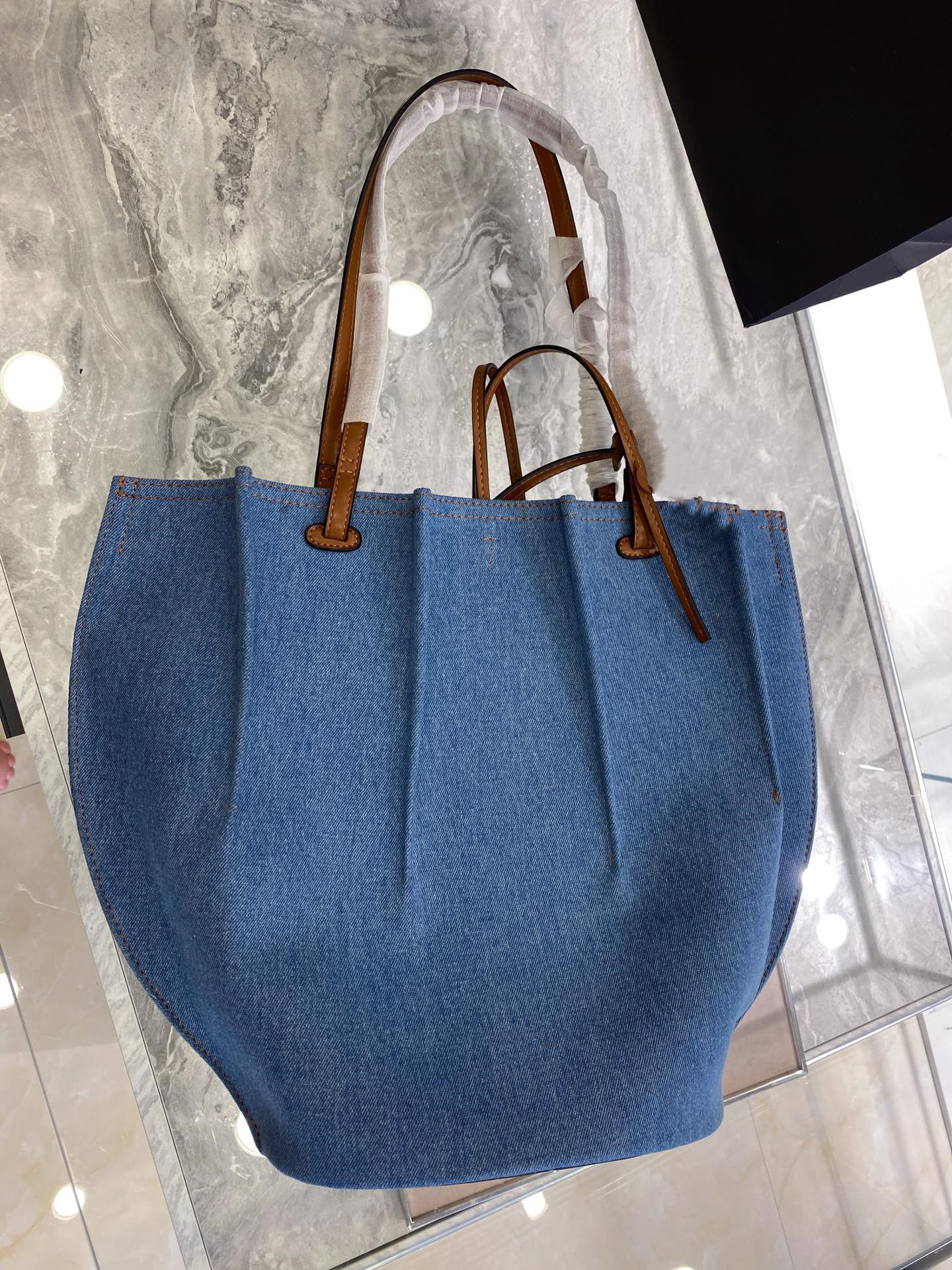 

Denim tote bag senior simple classic brown straps and delicate fold process unique stereo feeling gives people the that find everything fresh