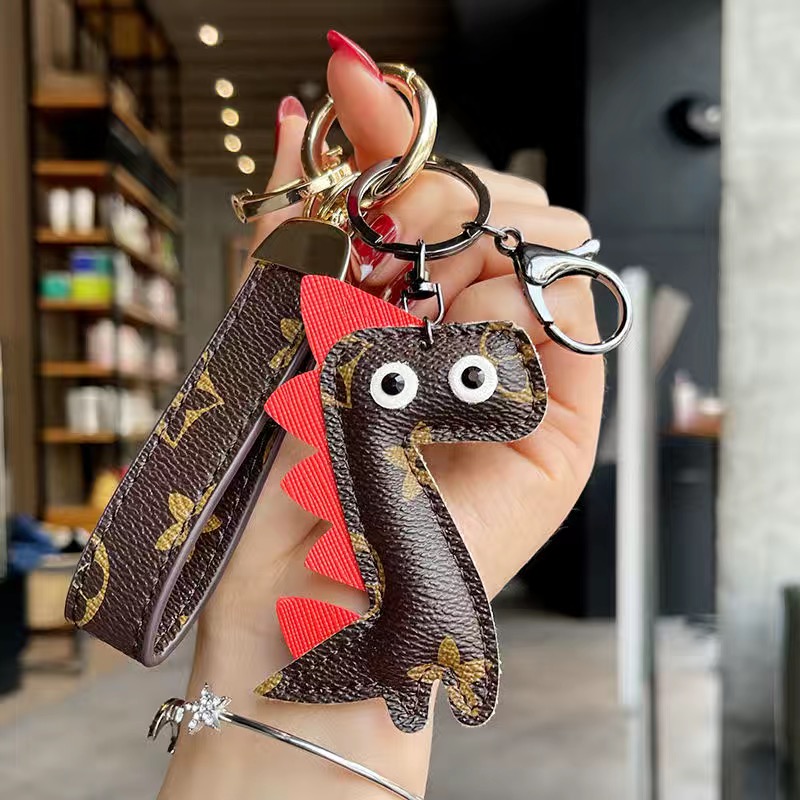 

Wholesale-2021 Women Fashion Keychain Lovely Dragon Hair ball Personality Luxurys Designer Keychains High Quality Electroplate Key Buckle