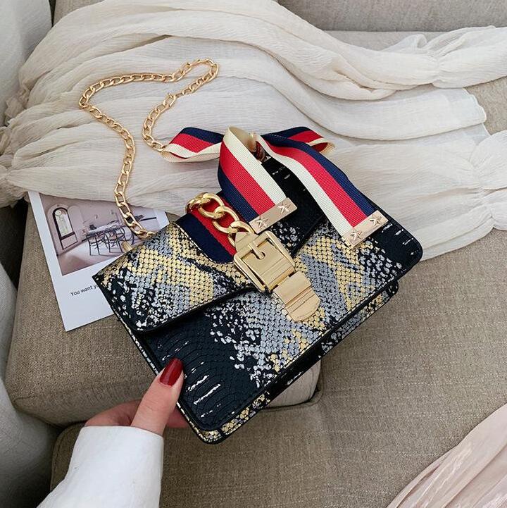 

Factory wholesale women handbag sweet lovely bow womens messenger bags gold metal lock chain bag contrast serpentine leather handbags