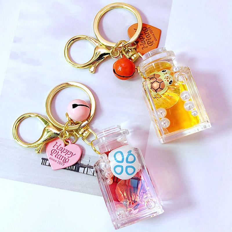 

Keychains Cute Floating Ocean Doll Keychain Fashion Water World Animal Liquid Quicksand Bottle Key Chain Creative Bag Backpack Pendant