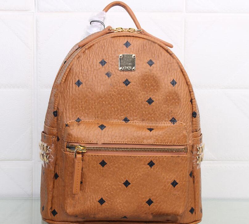 

Genuine Leather backpacks luxurys designers Fashion punk rivet backpack school bag tote unisex student bag men women travel STARK BACKPACK Top quality, Red