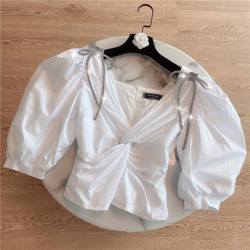 

Women' Blouses & Shirts 2021 Summer White Blouse For Women Temperament Rhinestone Bow V-neck Puffed Sleeves Short Shirt Crop Top Blusas