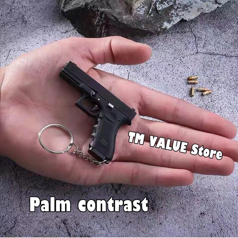 

Keychains 2021 1:3 17 Gun Model Keychain Metal Shell Simulation Ejection Process Can Not Fire Bullets Birthday Gift Boy Favorite