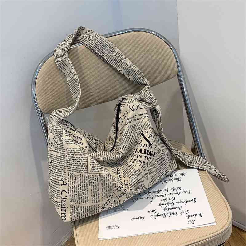 

Korean ins minority cotton hemp English newspaper messenger canvas lazy wind soft carrying extra large bag female, Blue