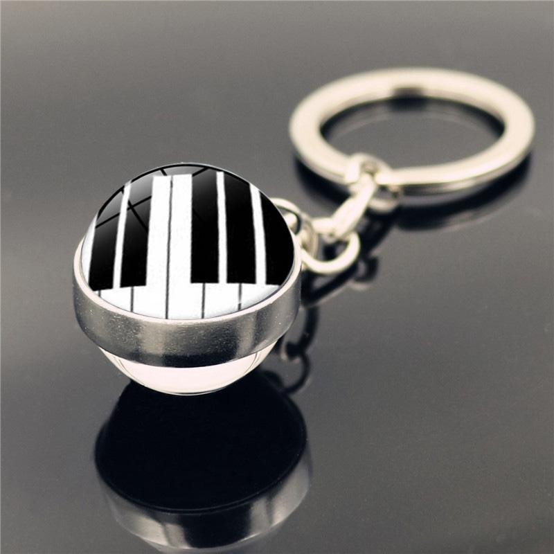 

Keychains Musical Instrument Keychain Grand Piano Key Trumpet Clarinet Fashion Double Side Glass Ball Chain Holder For Men Women Gifts