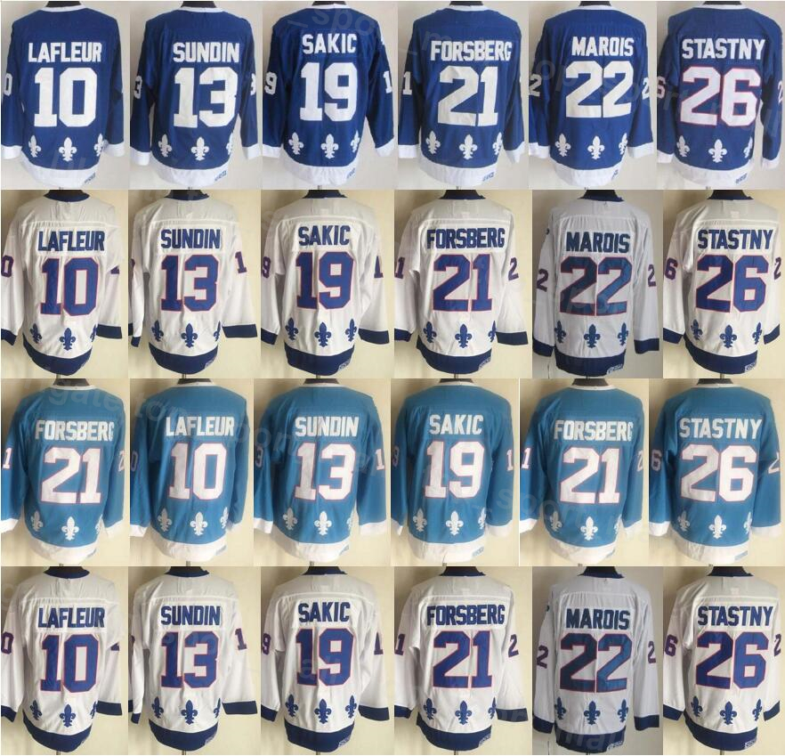 

Men Vintage Retro Ice Hockey 13 Mats Sundin Jersey CCM 19 Joe Sakic 21 Peter Forsberg 26 Peter Stastny 10 Guy Lafleur Home Navy Blue White All Stitched Sports KuiBeiKe