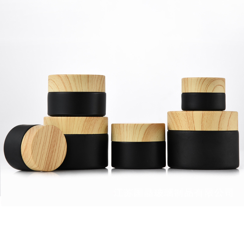 

Wholesale Black Frosted Glass Jars Cosmetic Jars With Woodgrain Plastic lids PP liner 5G 10G 15G 20G 30G 50G lip Packing Bottles