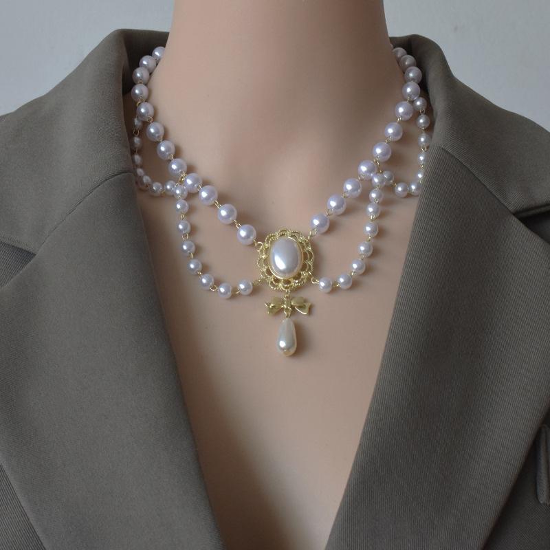 

Chokers Handmade Woven Hollow Pearl Necklace Vintage Bride Tassel Wave Edge Clavicle Chain Wedding Dress Accessories