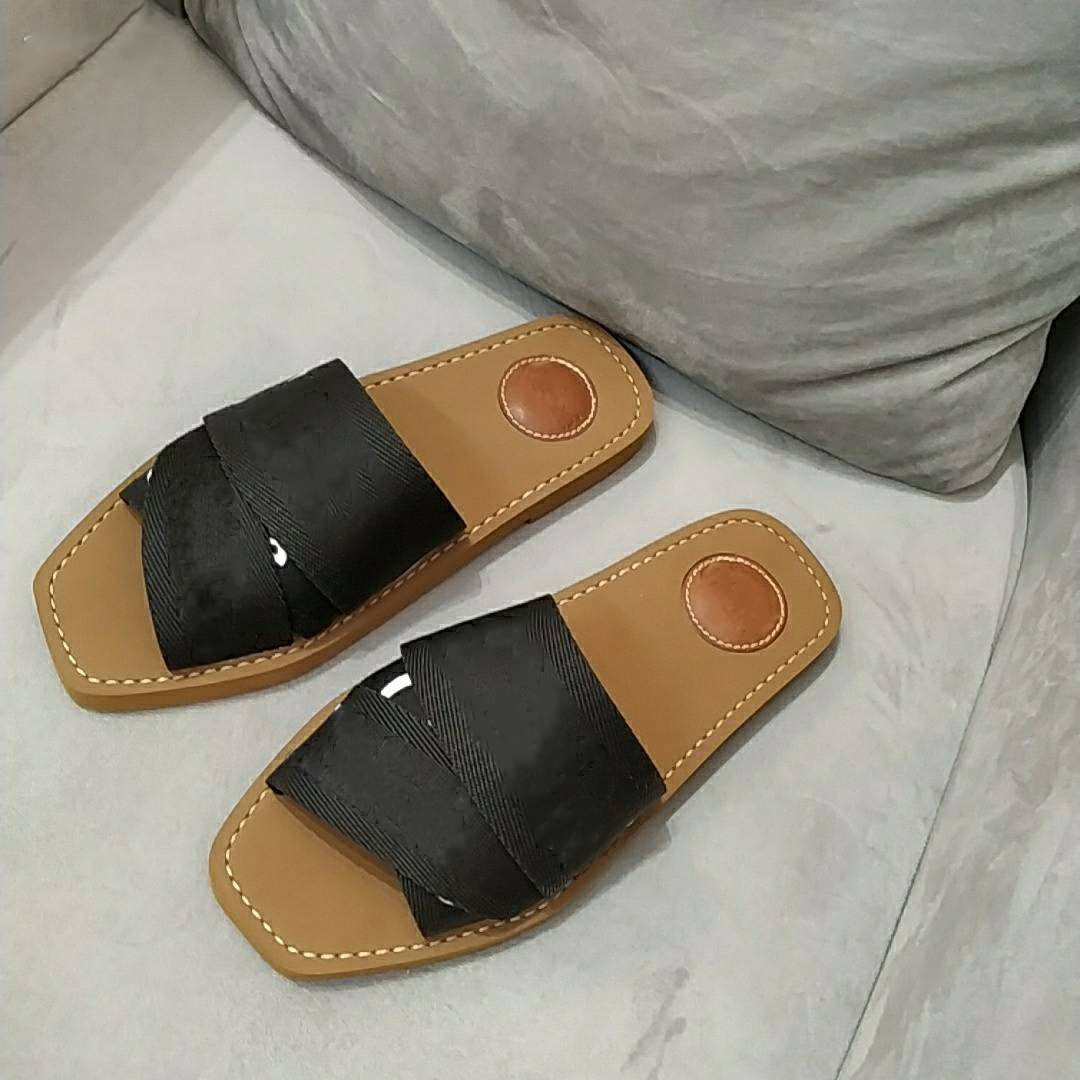 

Women Designer Slippers Woody flat mule in canvas and calfskin cross straps lettering flip flops Fashion sandal Summer Casual Shoes US 12 With Box 290, Black
