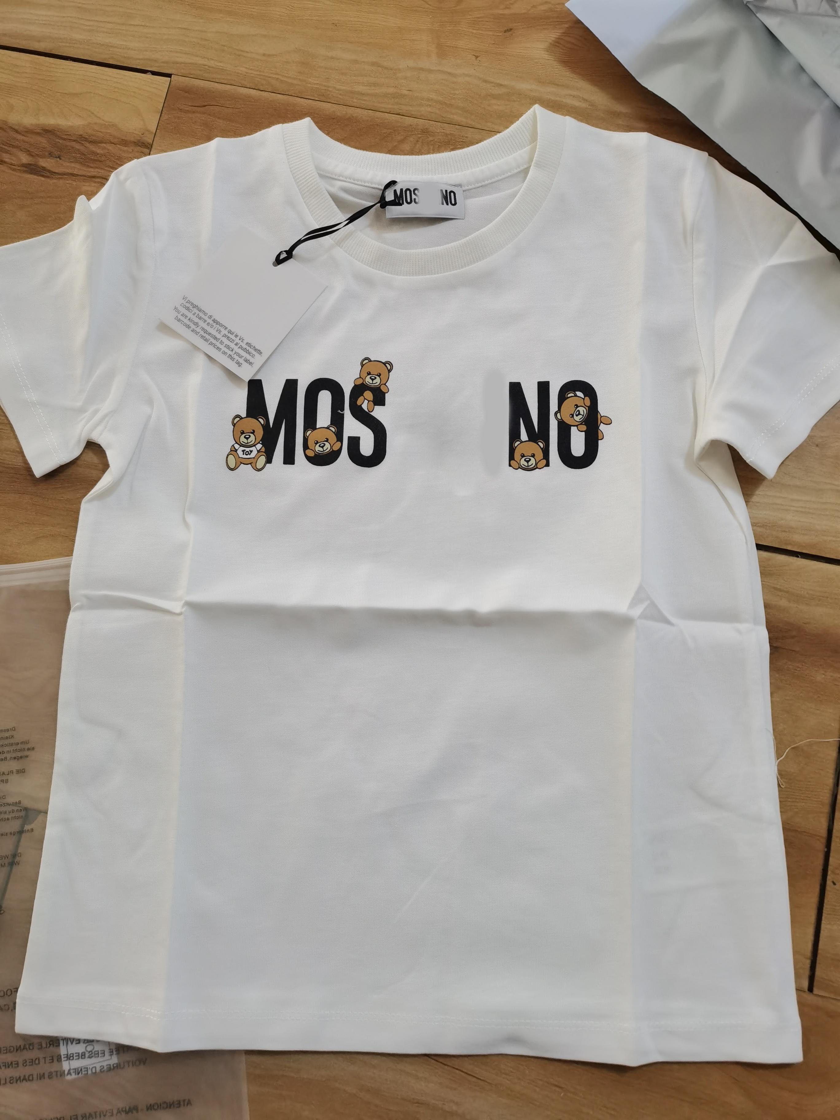 

2021 top brand white and black classic summer cartoon bear T-shirt for boys and girls, children's wear is comfortable and luxurious