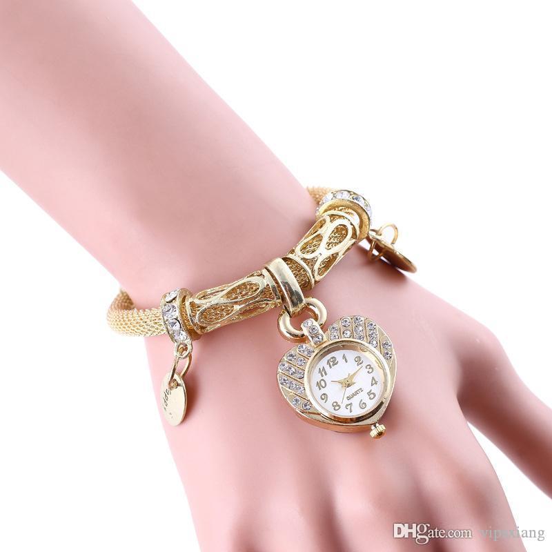 

Woman fashion dress watches Hollow Stainless steel snake skin texture band Bracelet Rhinestone Quartz watch gift gold Heart shaped dial