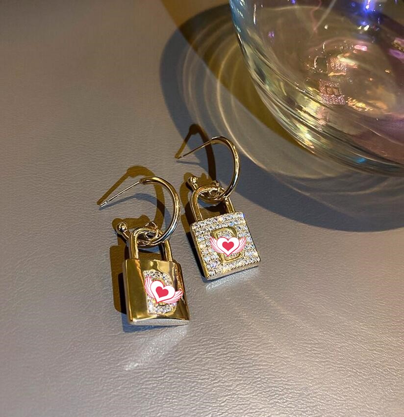 

2021 letter Dangle & Chandelier female diamond lock big brand Hong Kong trend metal net red temperament earrings high quality fast delivery