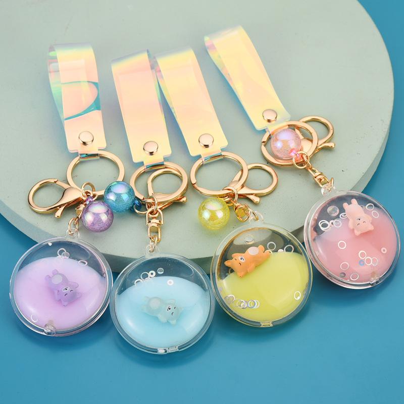 

Keychains Jelly Disc Liquid Keychain Cute Doll Bear Oil Floating Key Ring Magic Color Leather Rope Bag Car Pendant Holder Gifts