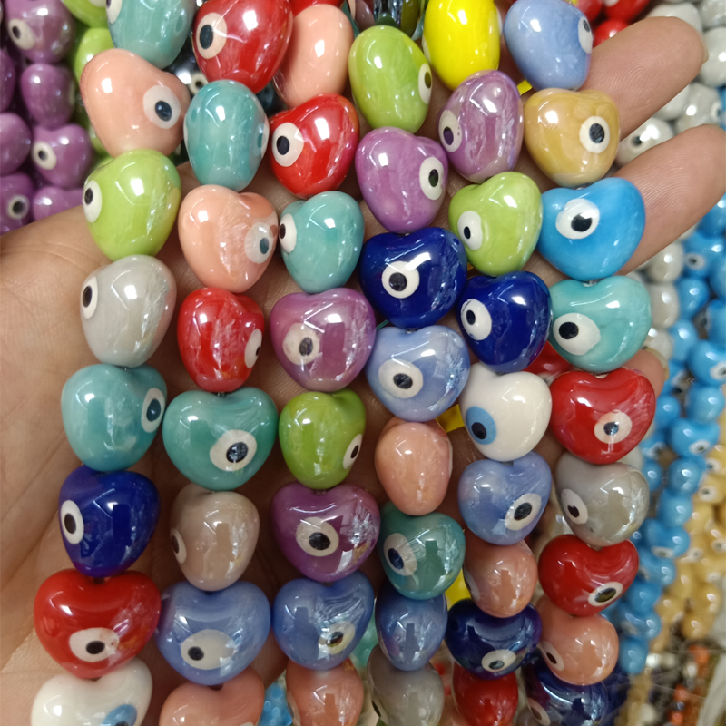 

100pcs 15x17mm Heart Shape Evil Eye Ceramic Beads Loose Spacer White/Red/Blue/Green/Purple/Pink Ceramics Bead For Jewelry Making