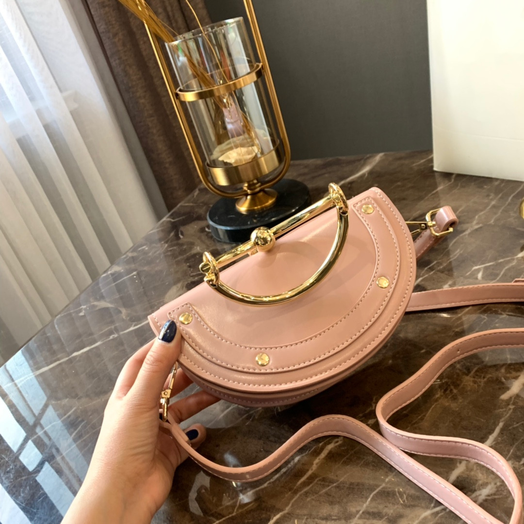 

2021 autumn and winter new leather handbag metal ring saddle metal Nile bracelet bag women's shoulder messenger half moon messenger bag
