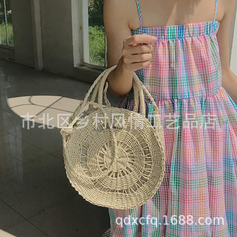 

Buckle Round Straw Hollow Woven Portable Messenger Bag in Spring and Summer of 2021