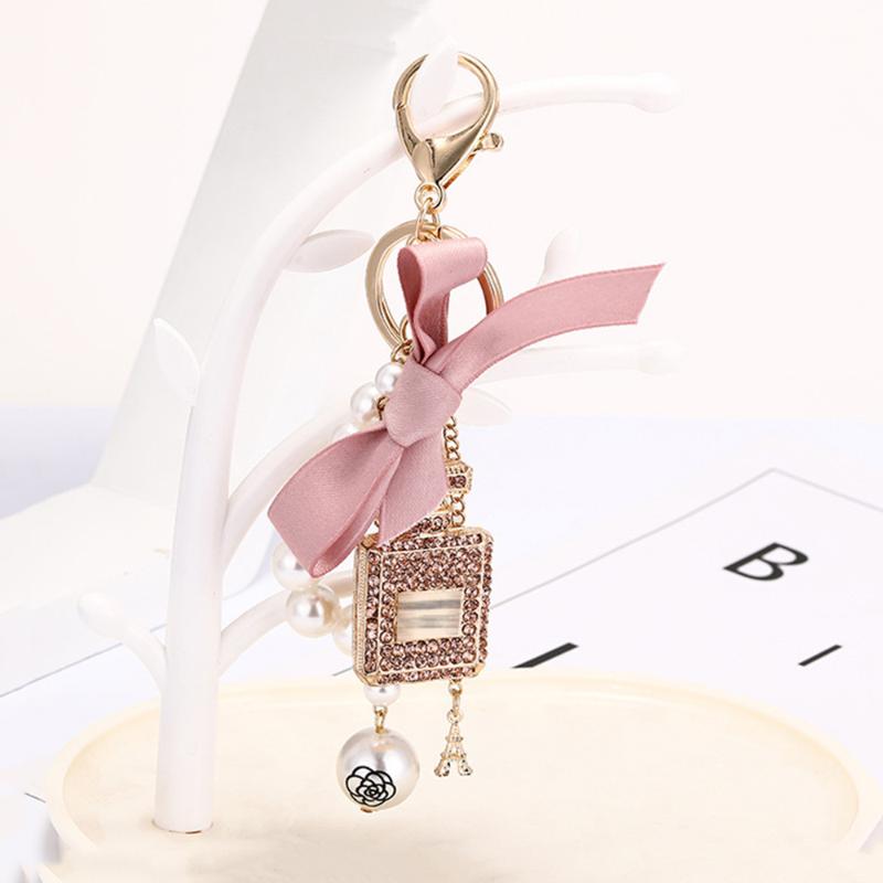 

Keychains 1Pc Exquisite Diamond Bowknot Perfume Bottle Keychain Imitation Pearl Beaded Tassel Chain Keychin Bag Pendant Accessories