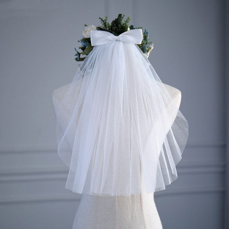 Veaux de mariée courte robe de mariée en tulle voiles de ruban blanc arc bord avec peigne peigne de cheveux vide de cheveux mariée accessoires de