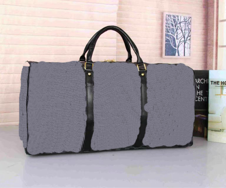 

2021 55CM large capacity women travel bags sale quality women men shoulder duffel bags carry on luggage bottom rivets with lock head