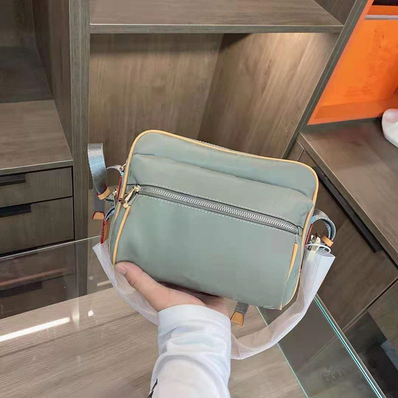 

2021 New Men Laser Camera Bag Inclined Unisex Genuine Leather Handbag Shoulder Bags For Men And Women With High Quality