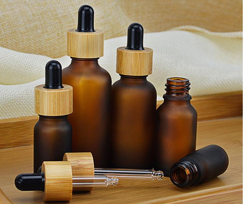 

5 10 15ml 30ml 50ml Frosted/ clear Amber Glass Dropper Bottle with Bamboo Cap 1oz Bamboos Essential Oil Bottles