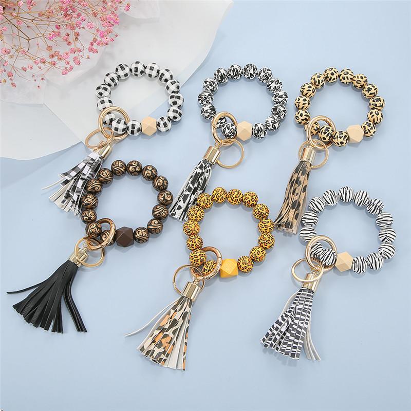 

Keychains 1pcs Leopord Pattern Keychain Wood Beads Keys Wristlet Bracelet Pendant Keyring For Women Tassel Charms Accessories